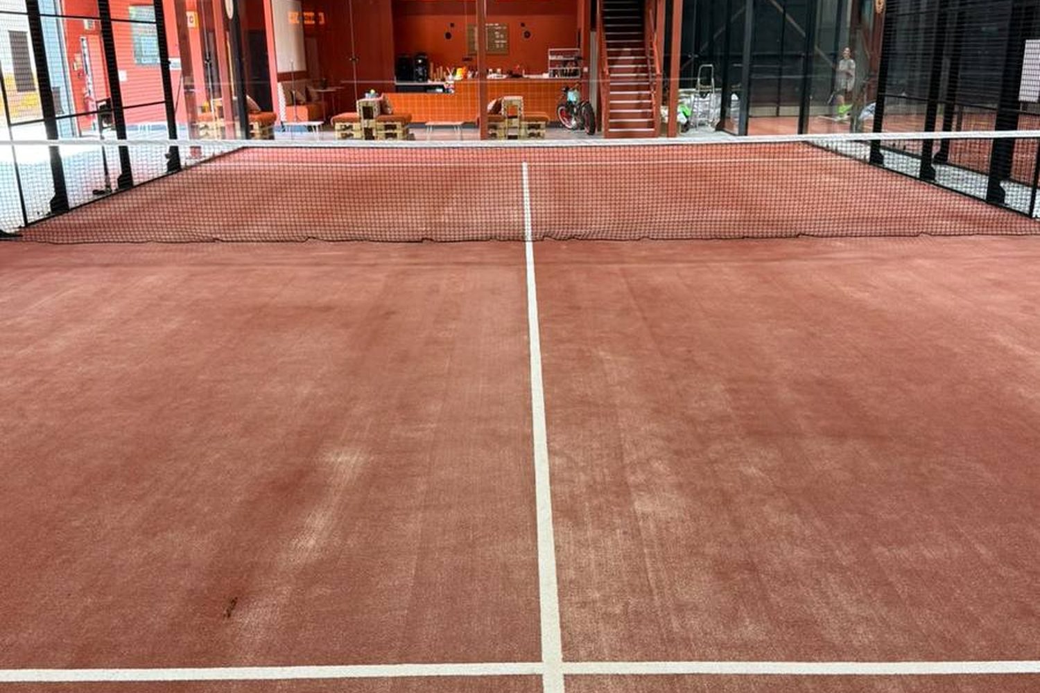 The same court after cleaning, with the sand brushed level and the lines clear
